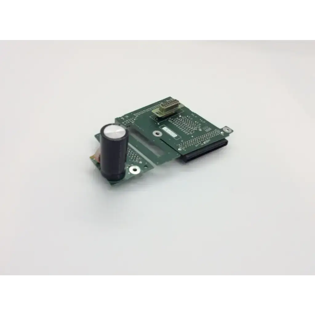 Green circuit board pcb assembly interconnect featuring black cylindrical capacitor and metallic connectors for spacelabs
