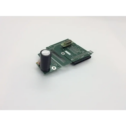 Green circuit board pcb assembly interconnect featuring black cylindrical capacitor and metallic connectors for spacelabs