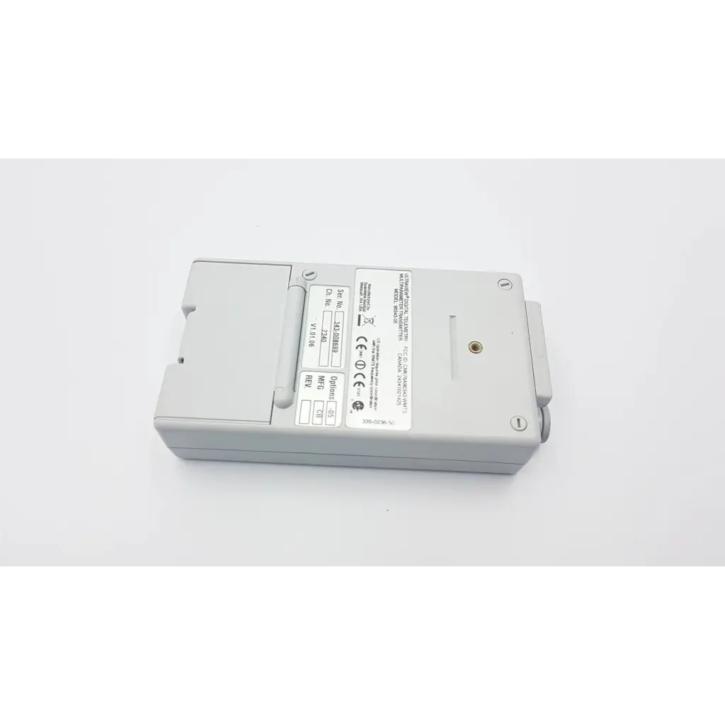 Gray rectangular spacelabs 90343-05 ultraview digital telemetry multiparameter transmitter with technical label and certification marks