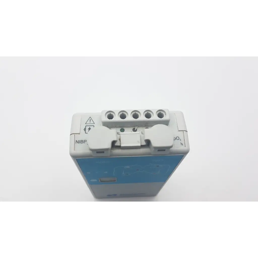 Gray and blue spacelabs 90343-05 ultraview digital telemetry multiparameter transmitter with labeled ports for vital signs