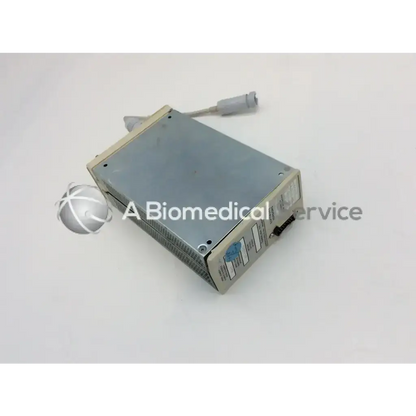 Gray metallic SpaceLabs 90467 patient monitor module with gray cable and connector for patient monitor use