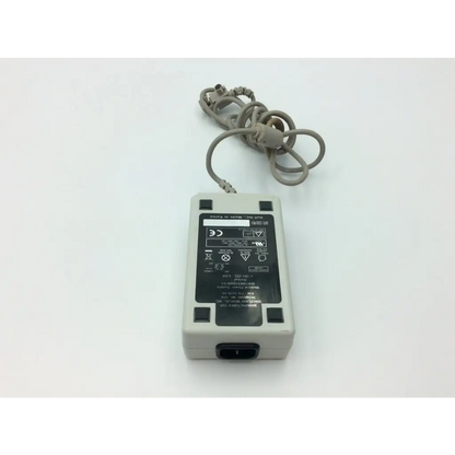 Gray plastic spacelabs medical 119-0479-00 lcd display power supply with coiled gray cable and black regulatory label