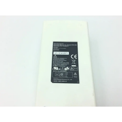 White rectangular spacelabs medical power supply with ac input 100-240v and black safety label visible
