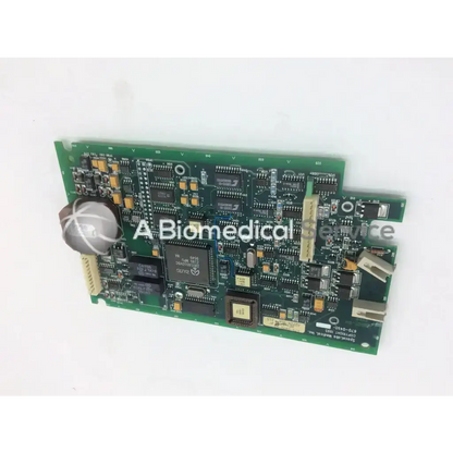 Green rectangular pcb circuit board with black and gold components labeled spectra medical inc from spacelabs medical
