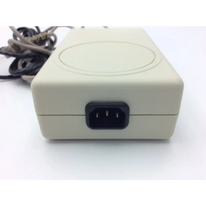 Beige rectangular spacelabs mw100 electro medical power supply with black three-pronged plug and oval indentation