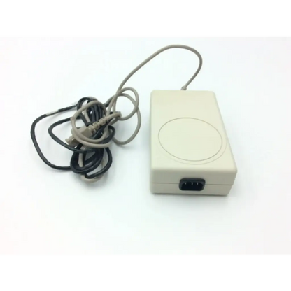 Beige rectangular spacelabs mw100 electro medical power supply with coiled gray cable and black plug for medical power use