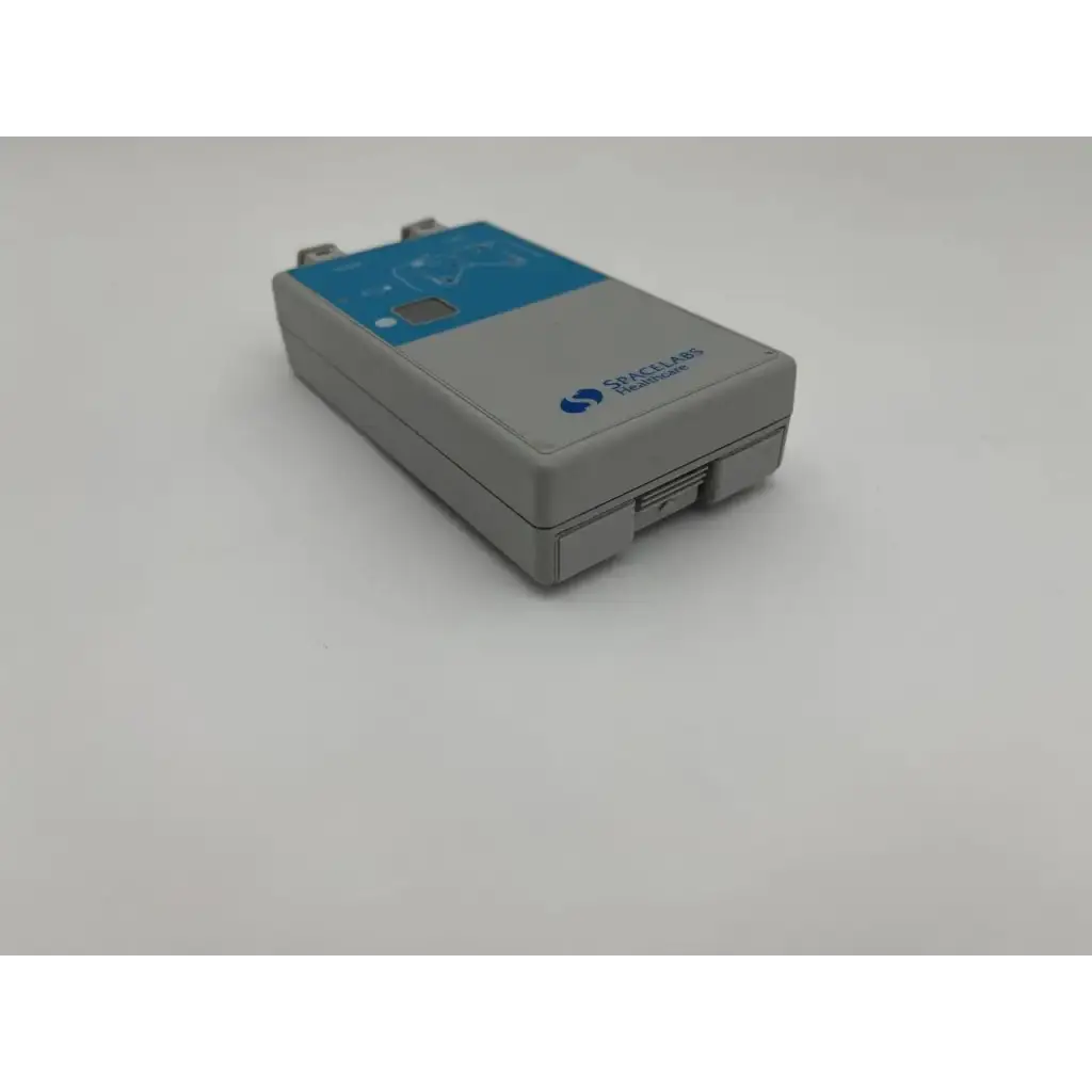 Gray and blue rectangular spacelabs ultraview digital telemetry transmitter 90343 with small screen and spectra technologies label
