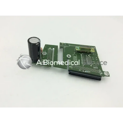 Green printed circuit board with black capacitor and gold connector for spacelabs ultraview sl patient interconnect board pcb
