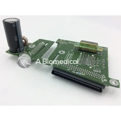 Green printed circuit board with black cylindrical capacitor and gold connector for spacelabs ultraview sl patient interconnect board pcb