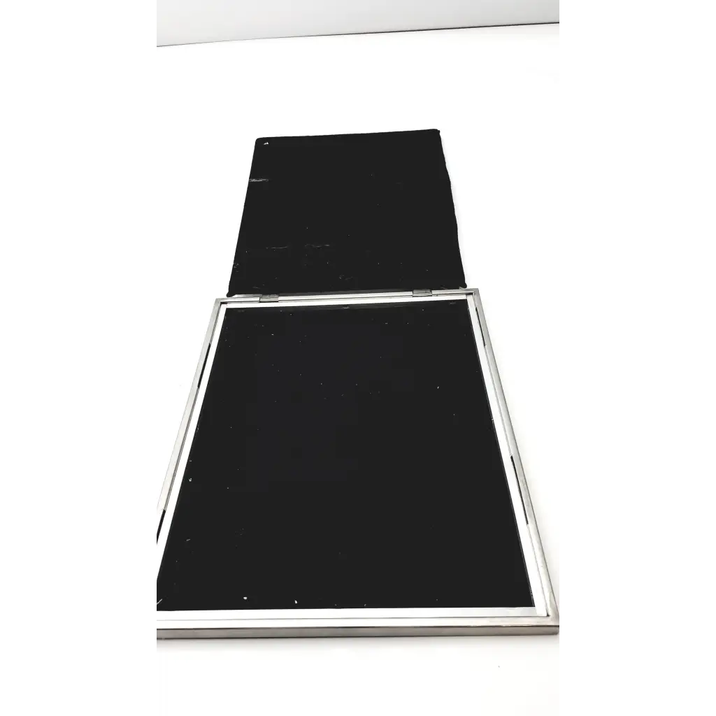 Silver-framed compact mirror with black mirrored surfaces and hinged design in spectroline 10x12 radiographic cassette style