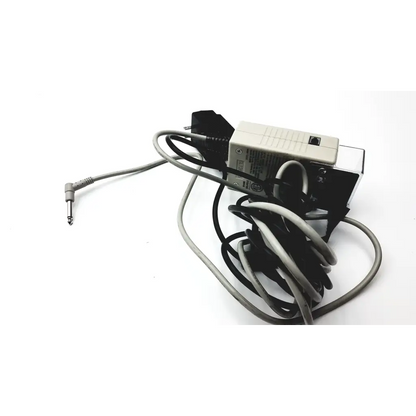 Gray and black power adapter with coiled cables and beige plastic housing featuring angled audio jack for stanley classic check 72020