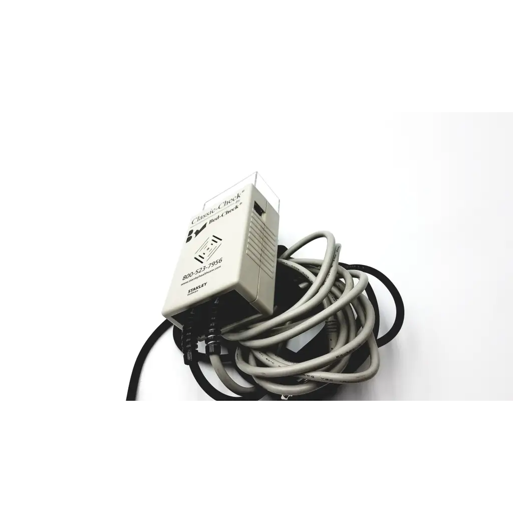 Beige plastic Stanley Classic-Check bed check device with coiled cables for fall risk monitoring and bed check
