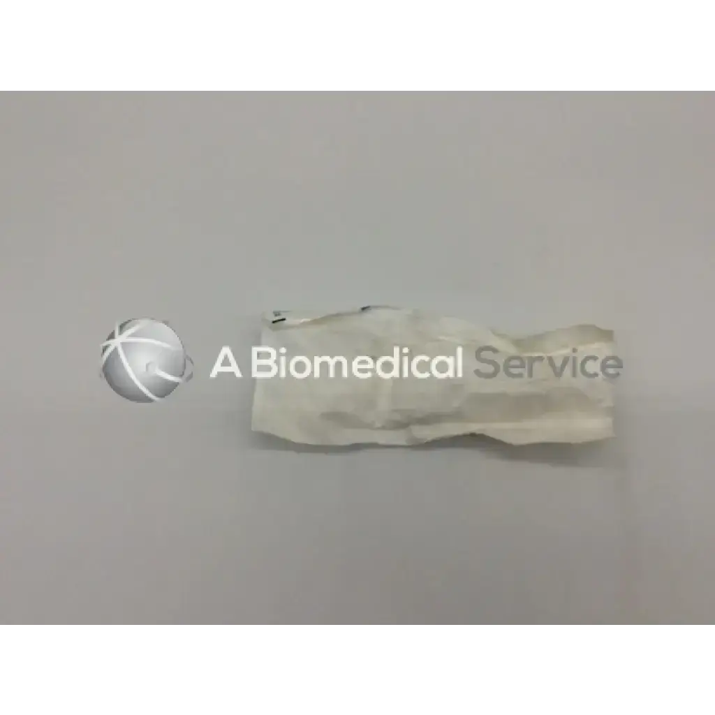 A crumpled white sterile medical glove used with sterrad chemical indicator for effective sterilization monitoring