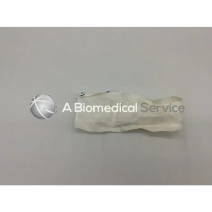 A crumpled white sterile medical glove used with sterrad chemical indicator for effective sterilization monitoring
