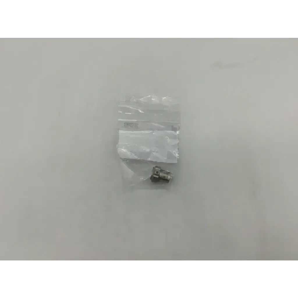 Silver metallic electrical connector in clear plastic bag for storz 10315m glass window plug product packaging