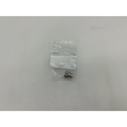 Silver metallic electrical connector in clear plastic bag for storz 10315m glass window plug product packaging