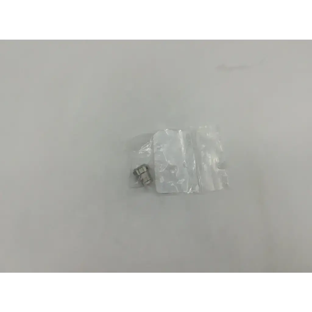 Silver metallic cylindrical component in clear bag for storz 10315m glass window plug product packaging