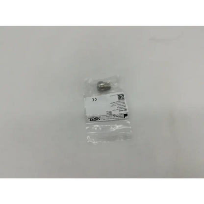 A metallic storz 10315m glass window plug with a threaded cylindrical body and hexagonal head in clear plastic packaging