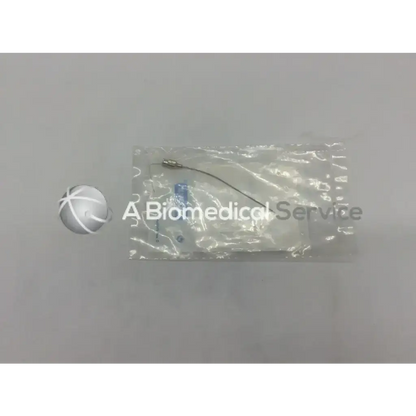 A sterile clear plastic package containing the storz n1703 11b suction tip with thin metallic wire and blue-tipped components