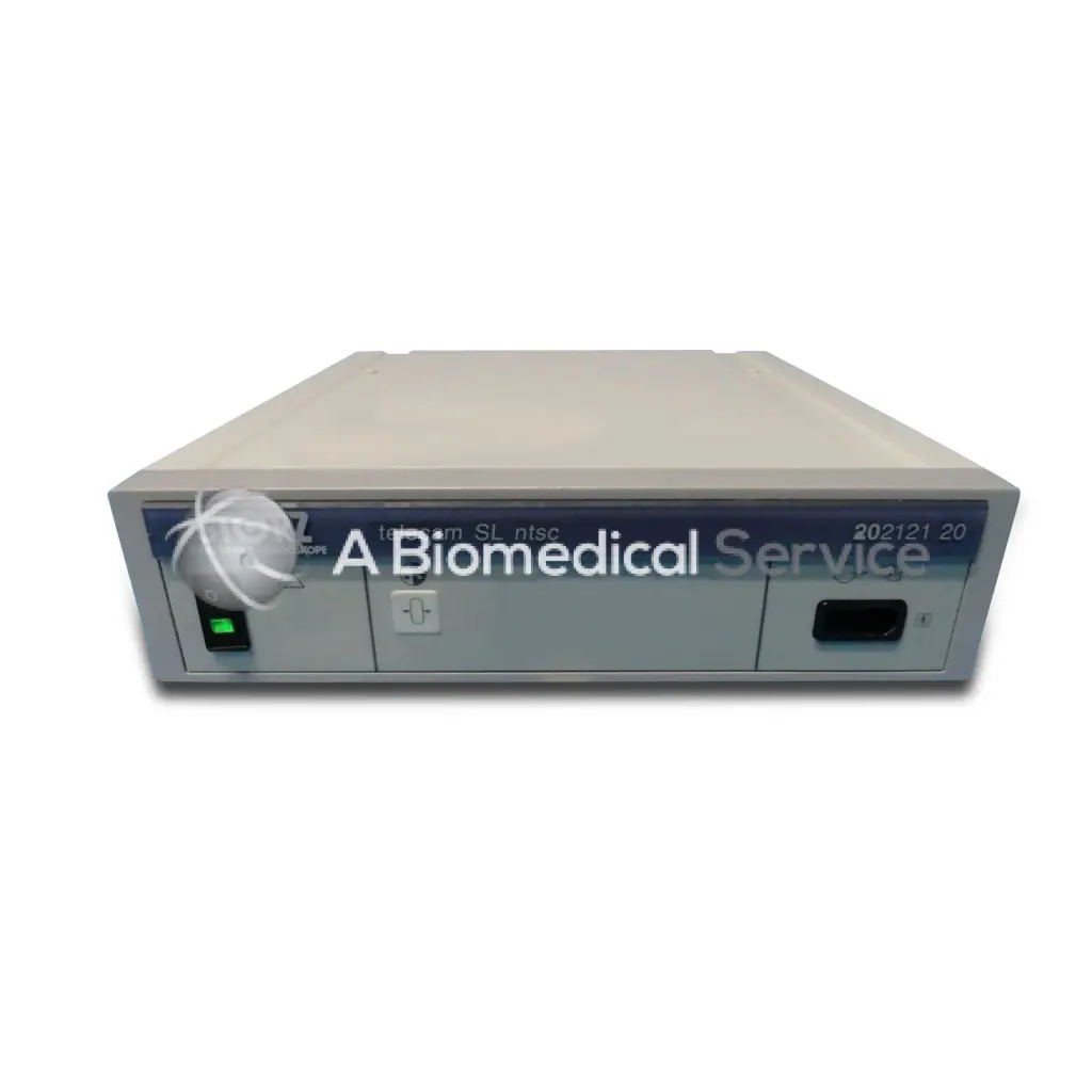 Beige and gray rectangular storz telecam sl 20 medical device with blue biomedical service label and model designation