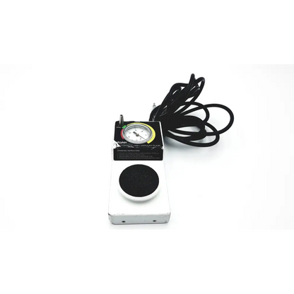 Stryker 206-500 automatic high vacuum foot pump with white rectangular pedal, black pad, and colorful dial pressure gauge
