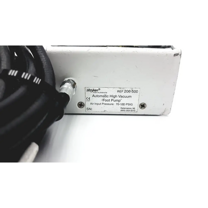 White metal Stryker 206-500 automatic high vacuum foot pump with black cables connected to the side for medical use