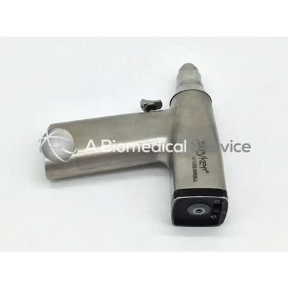 Silver metallic stryker 2102 drill orthopedic trauma with black accents and textured grip for surgical use