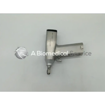 Silver metallic orthopedic surgical reciprocating hand-held saw with cylindrical handle and tapered tip by Stryker