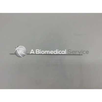 Silver spherical logo with stylized cross mounted on metallic rod of stryker 234-020-023 femoral eyeloop drill