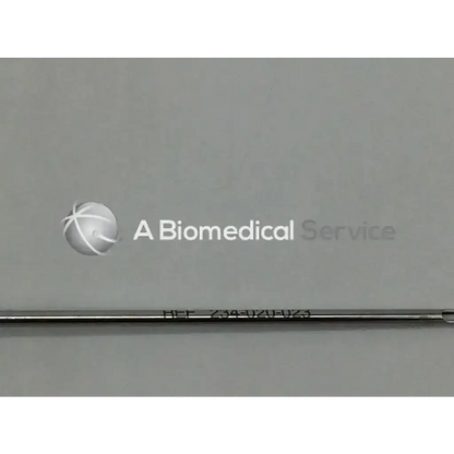 A sleek metallic stryker 234-020-023 femoral eyeloop drill with engraved markings lies horizontally on a neutral background