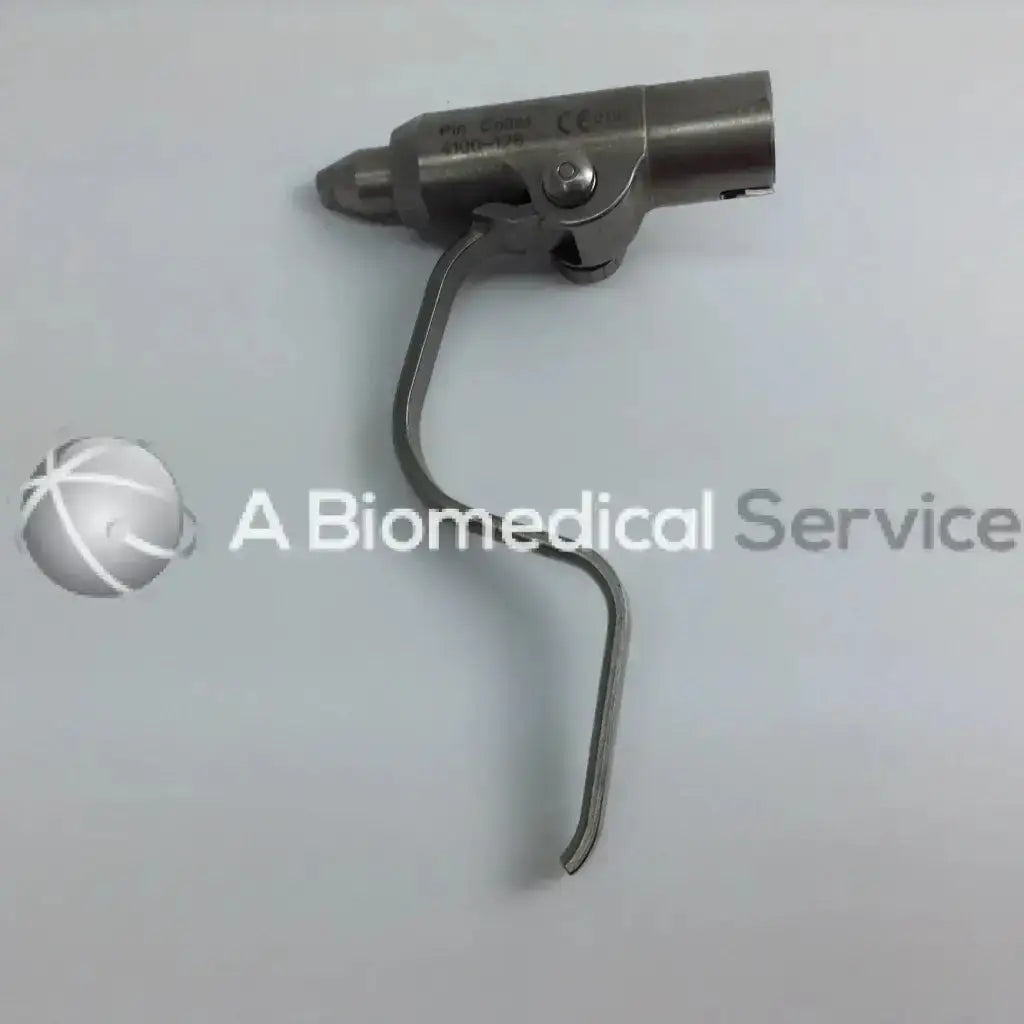 Stainless steel cordless driver set featuring a curved handle and engraved head in aesculap case for surgical use