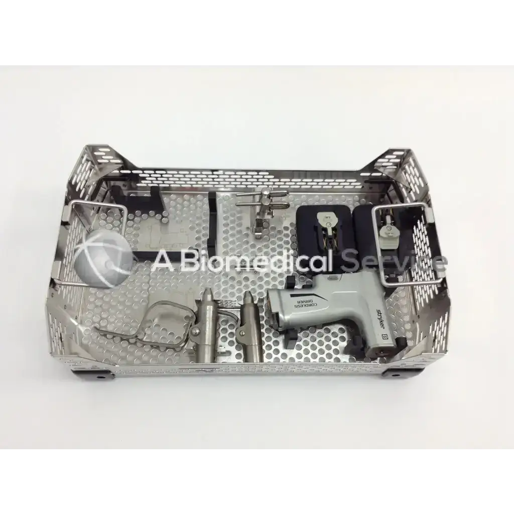 Silver perforated metal surgical tray holding stryker 4505 system 8 cordless driver set with micro 100 and aesculap case
