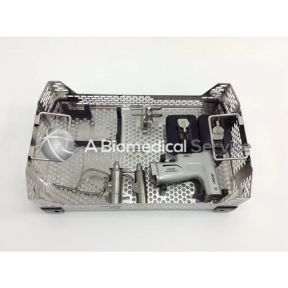 Silver perforated metal surgical tray holding stryker 4505 system 8 cordless driver set with micro 100 and aesculap case