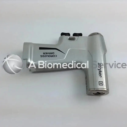 Silver stryker 4505 system 8 cordless driver set with micro 100 and aesculap case featuring black accents and ergonomic design
