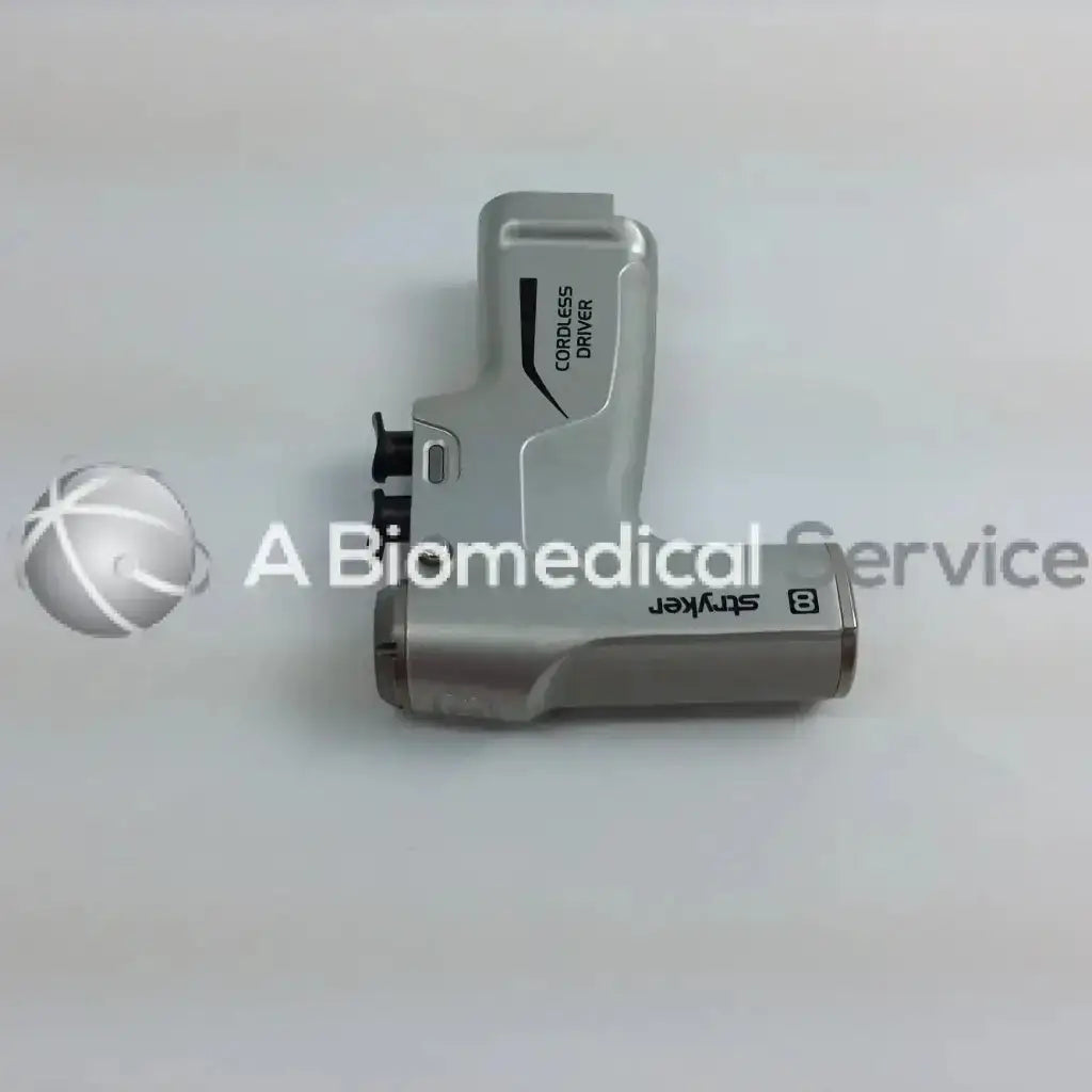 Silver stryker 8 cordless driver with ergonomic design and black text labeling in aesculap case driver set