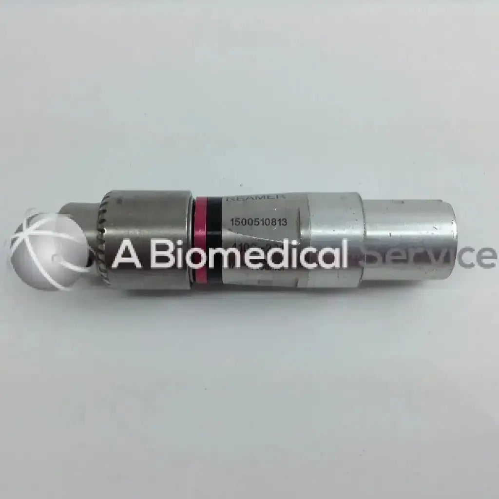Silver metallic cordless driver with spherical tip and engraved serial number in aesculap case from stryker 4505 set