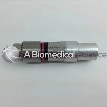 Silver metallic cordless driver with spherical tip and engraved serial number in aesculap case from stryker 4505 set