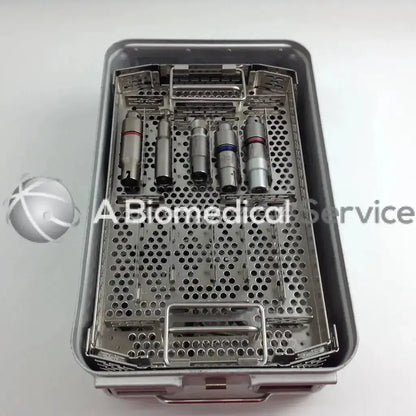 Sterilized metallic dental handpieces with colored bands in a stryker 4505 cordless driver set aesculap case