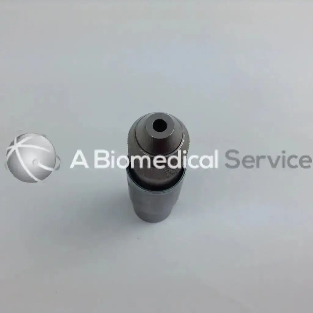 Gray metallic cordless driver with cylindrical body and threaded top in stryker 4505 system 8 driver set aesculap case