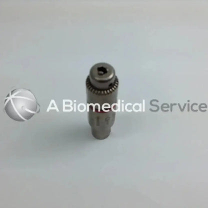 Gray metallic cordless driver with threaded section and hexagonal top from stryker 4505 driver set aesculap case