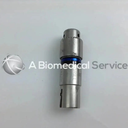Silver metallic surgical drill bit with blue accent ring and engraved markings in stryker 4505 cordless driver set aesculap case