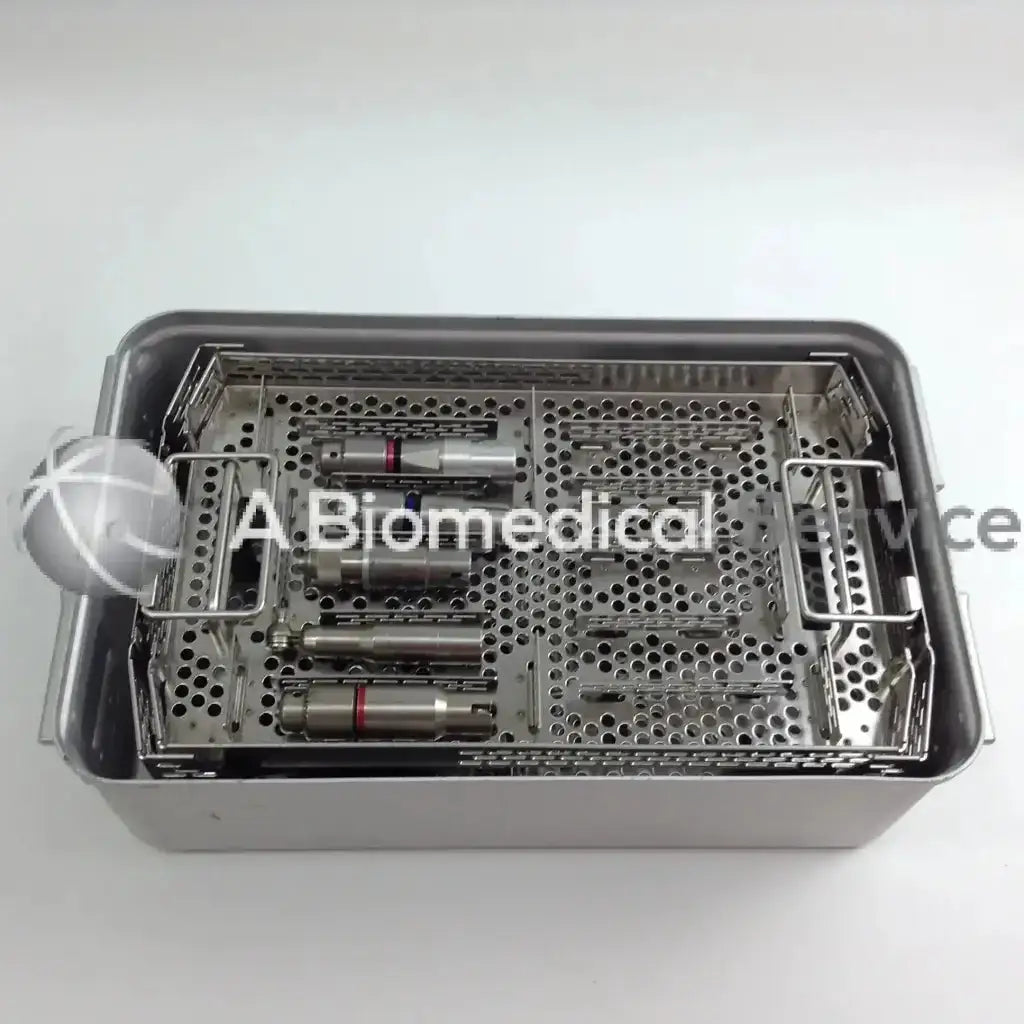 Stainless steel surgical instrument tray with perforated compartments holding medical tools for aesculap case driver set
