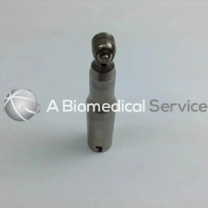 Silver dental handpiece with polished metallic finish and rounded head in stryker 4505 system 8 cordless driver set with aesculap case