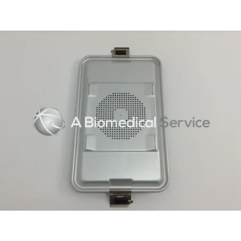 Silver metallic rectangular tray with perforated circular pattern and metal latches for aesculap case in cordless driver set