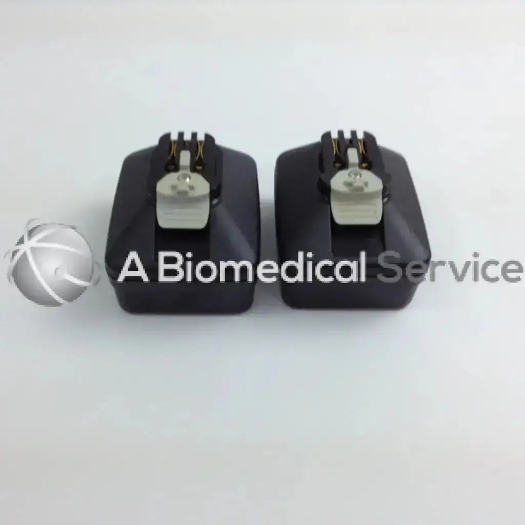 Black rectangular cordless driver set components with silver connectors and gold pins in aesculap case for stryker 4505 system