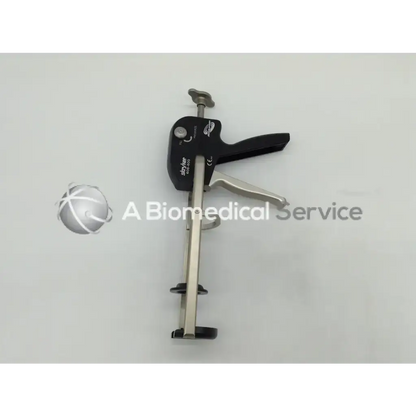 Black and silver metal stryker 606-600 revolution cement gun with handle trigger and adjustable clamp mechanism