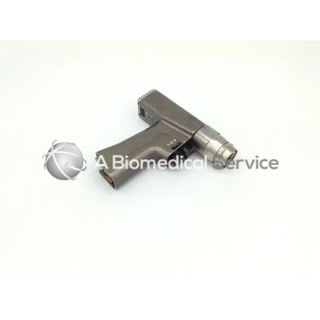 Gray metallic stryker 6205 system 6 dual trigger rotary handpiece with ergonomic grip and cylindrical bit attachment