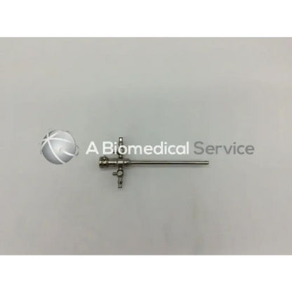 Stryker 747-031-550 stainless steel 5.8mm cannula with long shaft and three interconnected valves for surgical use