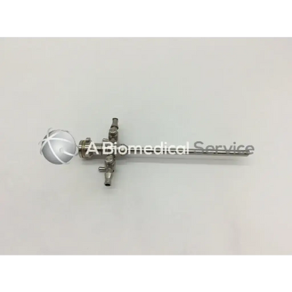 Silver stryker 747-031-550 5.8mm cannula with spherical handle and valve attachments for surgical use, similar to 8mm cannula ad4-35