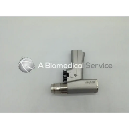 Silver stryker endoscopy 6205 system dual trigger rotary drill with sleek ergonomic handle and metallic cylindrical body